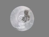 an overhead view of a wine glass on a gray surface