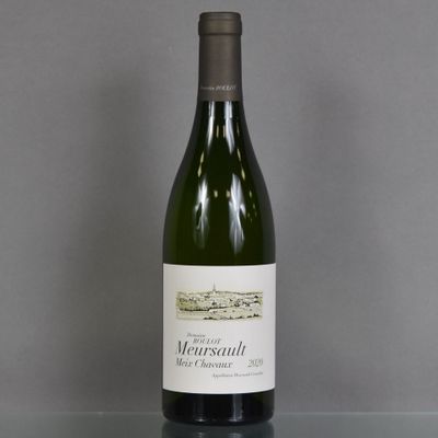 a bottle of wine that is sitting on a table
