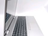 a close up of a laptop computer on a white surface