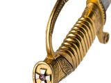 an image of a sword with a gold handle and a star on the blade