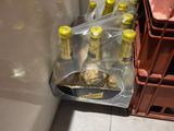 a refrigerator with a bunch of bottles of beer in it