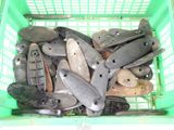 many different types of knives in a green basket