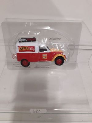 a red and white fire truck in a clear display case