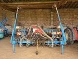 an image of a tractor and other machinery in a building