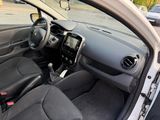 the interior of a small car with a steering wheel and dashboard
