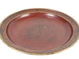 a brown plate with a gold rim on a white background
