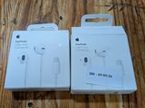 an apple earpods are sitting in a box on a wooden table