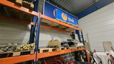 a large rack with various tools on it in a warehouse