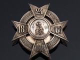 an image of a silver medal with a star on it