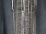 a bird cage with a bird inside of it on a table