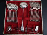 a box with a set of forks and spoons in it