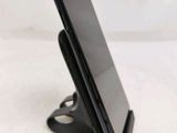 a cell phone that is sitting on top of a stand