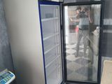 someone is taking a picture of the inside of a refrigerator