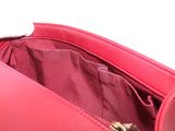 the inside of a pink purse with a zipper on the inside