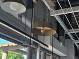 many lights hanging from the ceiling of a building