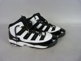 a pair of black and white sneakers on a white surface