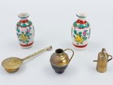 four different types of vases on a white surface