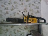 a chainsaw sitting on top of a shelf in a room