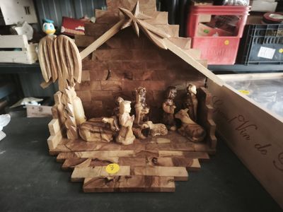 a nativity scene made out of wood on a table