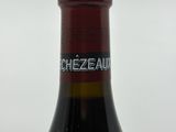 a bottle of wine that is sitting on a table