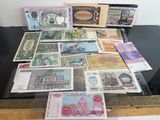 many different types of paper money on a table