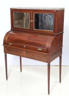 a small desk with a mirror on top of it