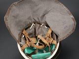 a hat that has a bunch of shoes inside of it