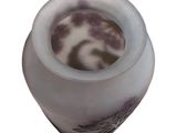 a white vase with a black and white design on it