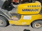 a small yellow machine that is parked in the parking lot