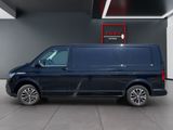 the blue van is parked inside of a building with a red sign above it