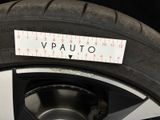 a close up of a tire with a measuring tape on it
