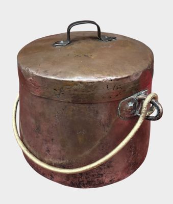 a large metal container with a rope around it