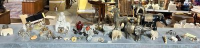 a table that has a lot of silver items on it