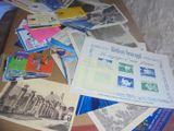 a pile of old postcards on a table