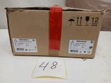 a box with a red ribbon on it sitting on a table