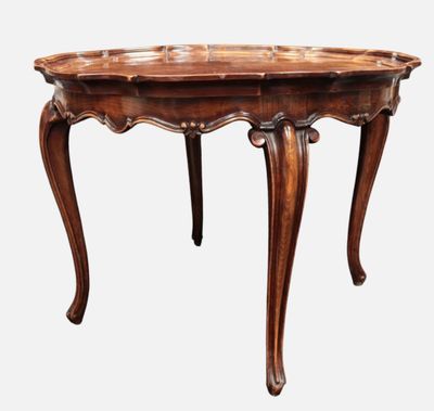 an old wooden table with a carved top on a white background