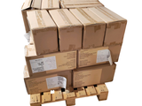 a stack of boxes on a pallet with a hand truck