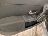a close up of a car door handle with a button on it