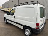 a white van that is parked in a parking lot