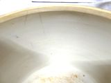 a close up of a white toilet bowl with the lid down