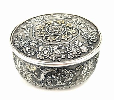an image of a silver box sitting on top of a white surface