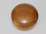 an image of a gold box on a white surface