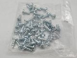 a bag of screws and nuts on a table