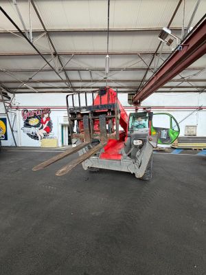 an image of a forklift parked in a warehouse