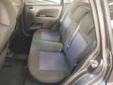 the back seats of a car with a blue seat cover