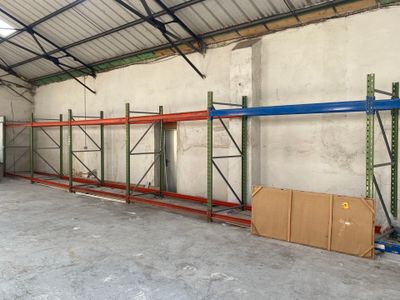 a large room with a lot of shelves and boxes in it