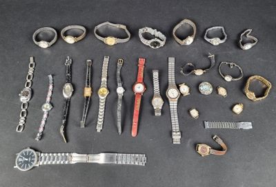 many different types of watches and bracelets laid out on a table