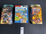 three pokemon trading cards sitting on top of a table next to each other