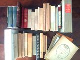 a lot of books that are on the table