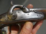 a person holding a gun in their hand